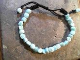 Bracelet with 29 Larimar gemstones on adjustable cord